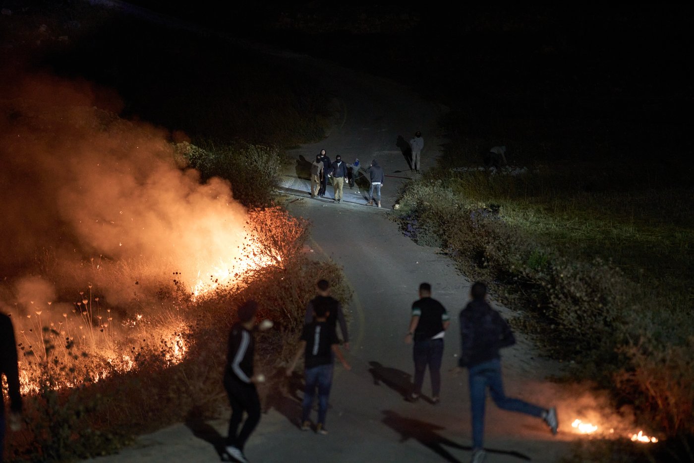 Photos show West Bank Palestinians keeping watch at night as settler violence grows | iNFOnews.ca