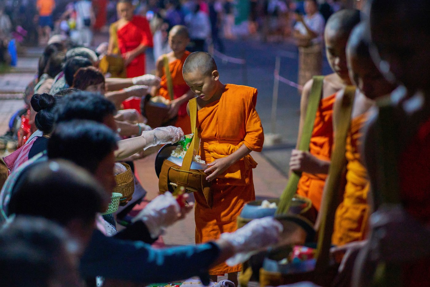 Photos of Buddhist monks in Laos praying in region littered with unexploded bombs | iNFOnews.ca