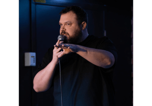 A man speaks into a microphone.