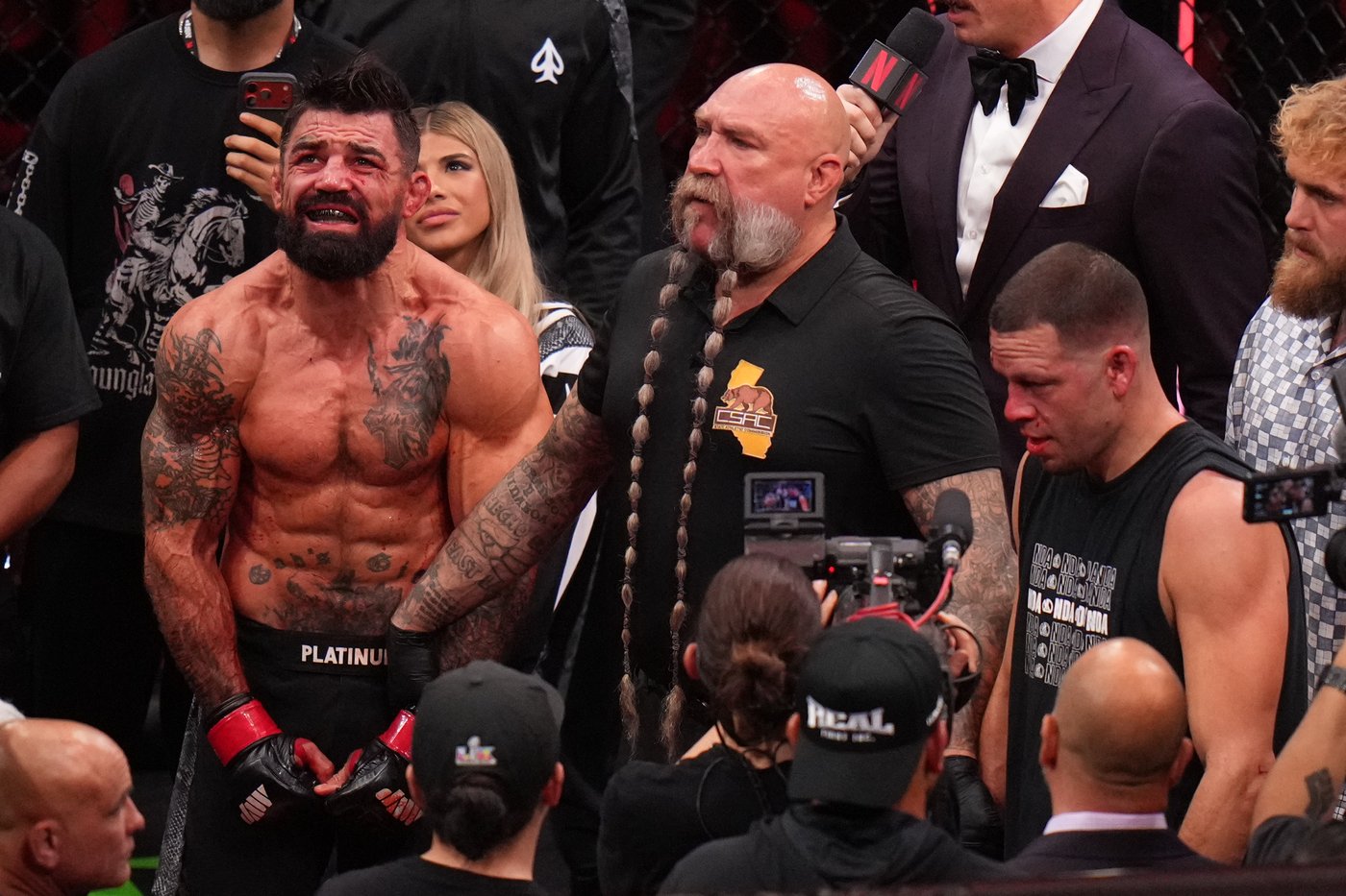 Mike Perry bloodies and beats Nate Diaz in 2 rounds on Rousey-Carano undercard | iNFOnews.ca Mike Perry bloodies and beats Nate Diaz in 2 rounds on Rousey-Carano undercard | iNFOnews.ca