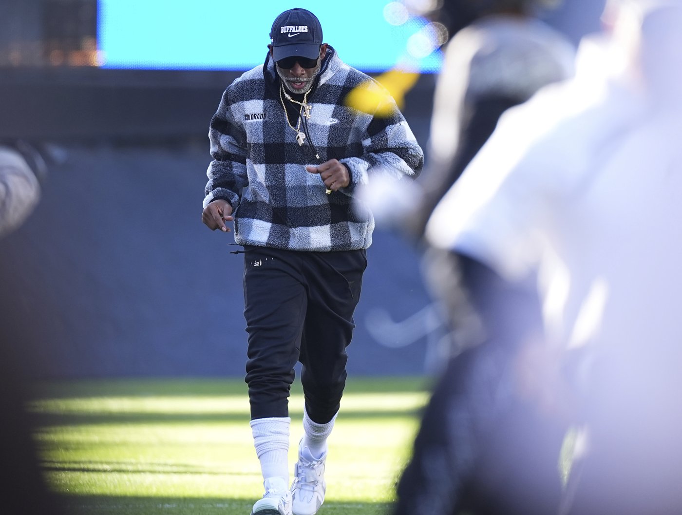 Deion Sanders dismisses speculation about future with No. 16 Colorado, says he's happy in Boulder | iNFOnews.ca