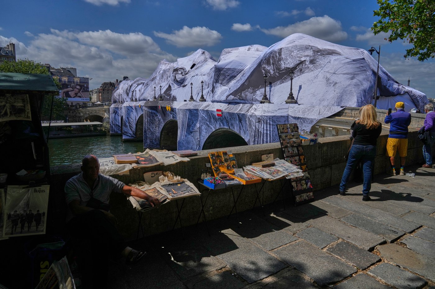 Artist JR, the 'French Banksy' creates a 'cave' installation over Paris' oldest bridge | iNFOnews.ca Artist JR, the 'French Banksy' creates a 'cave' installation over Paris' oldest bridge | iNFOnews.ca