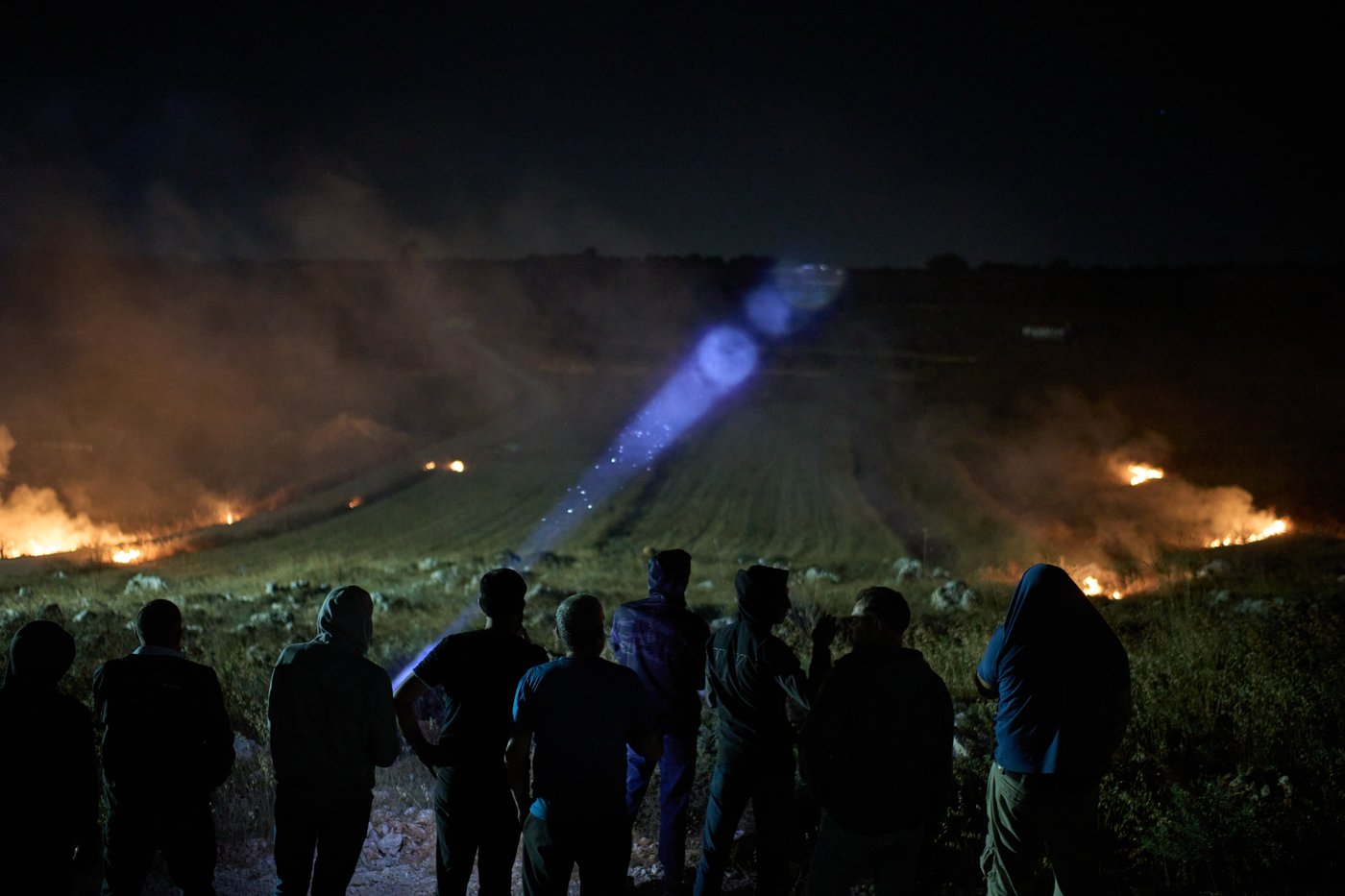 Photos show West Bank Palestinians keeping watch at night as settler violence grows | iNFOnews.ca