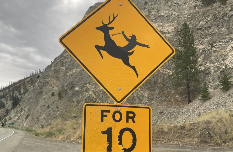 iN PHOTOS: Road signs in Kamloops, Okanagan that make you look twice | iNFOnews.ca A yellow road sign on a highway shows the silhouette of a cowboy riding a deer.