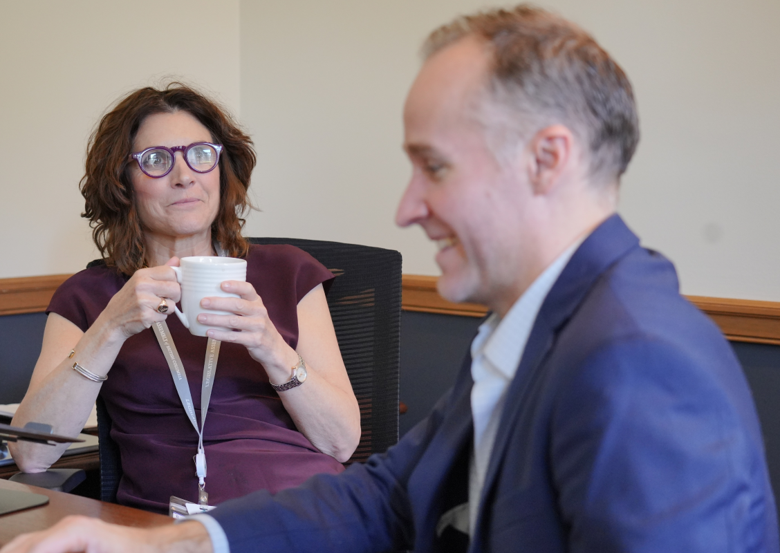A man and a woman in an office.
