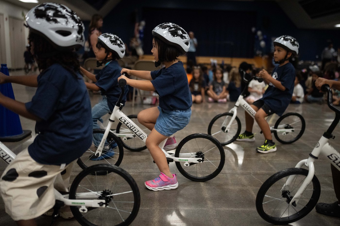A childhood rite moves indoors as kindergartners learn to ride bikes in school gyms | iNFOnews.ca