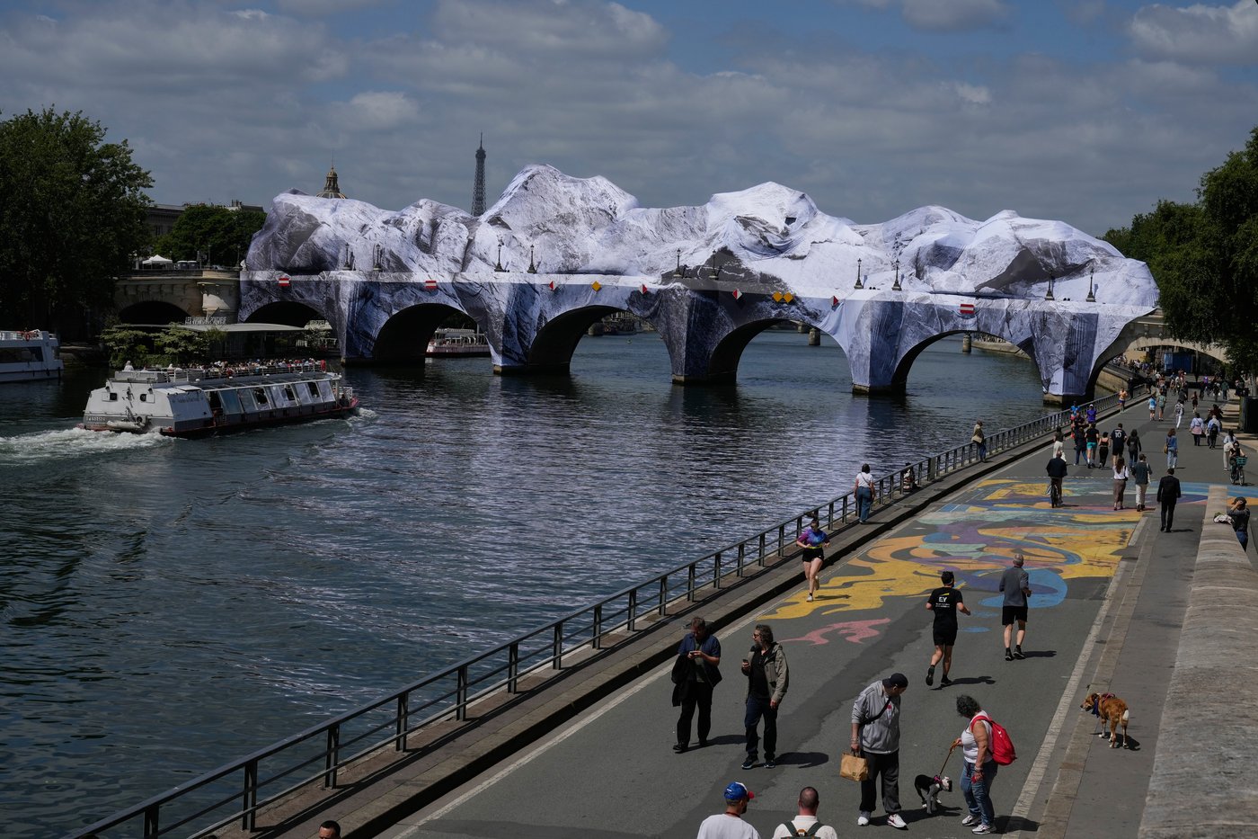 Artist JR, the 'French Banksy' creates a 'cave' installation over Paris' oldest bridge | iNFOnews.ca Artist JR, the 'French Banksy' creates a 'cave' installation over Paris' oldest bridge | iNFOnews.ca