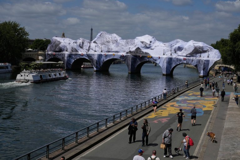 Artist JR, the 'French Banksy' creates a 'cave' installation over Paris' oldest bridge | iNFOnews.ca