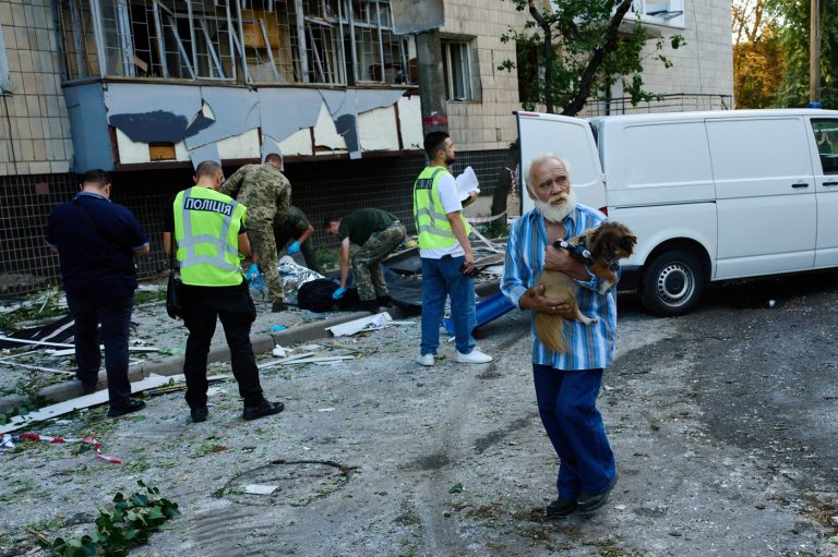 Photos show Kyiv residents clutching pets, collecting bodies after Russian missile and drone attack | iNFOnews.ca