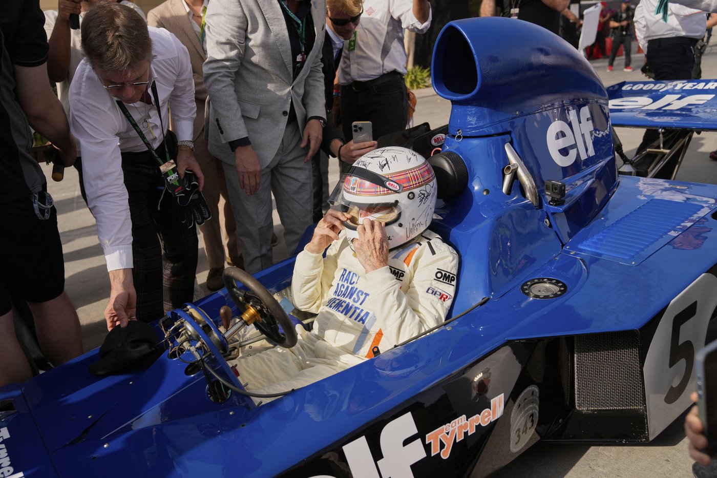 Michael Schumacher's signature on helmet worn by F1 champ Jackie Stewart at charity drive in Bahrain | iNFOnews.ca