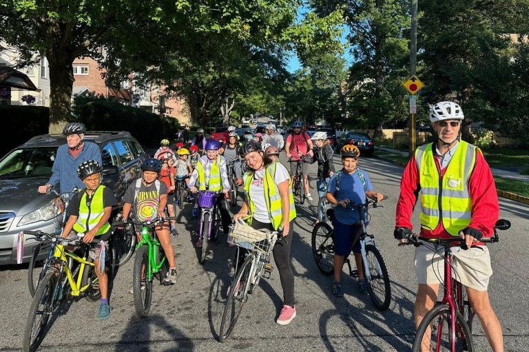 From a few to more than 350, children and parents ride together to school as a 'bike bus' | iNFOnews.ca