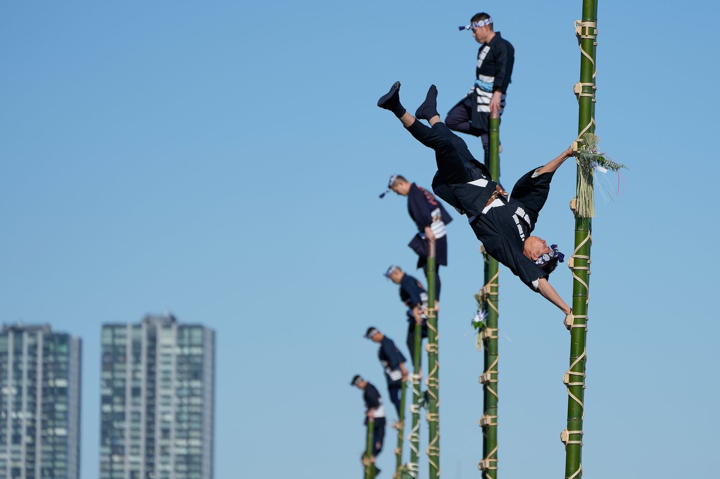 Photos show ladder stunts and other activities at a Tokyo fire brigade review | iNFOnews.ca