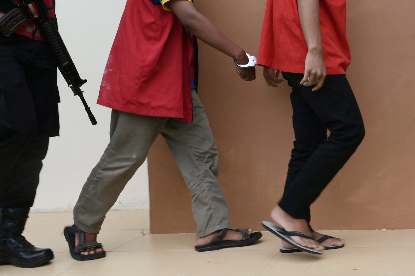 Islamic court in Indonesia sentences 2 men to public caning over sexual acts: kissing and hugging | iNFOnews.ca
