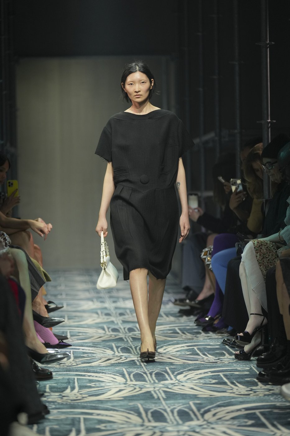 Prada reconstructs femininity starting with the little black dress fit to dark times | iNFOnews.ca