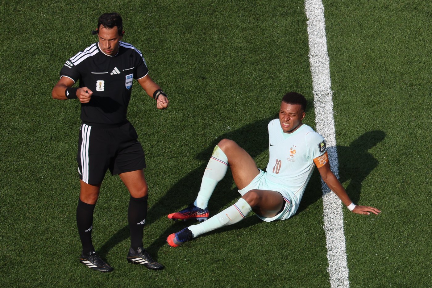Kylian Mbappé scores his 8th World Cup goal before leaving game with a 'slight' ankle injury | iNFOnews.ca
