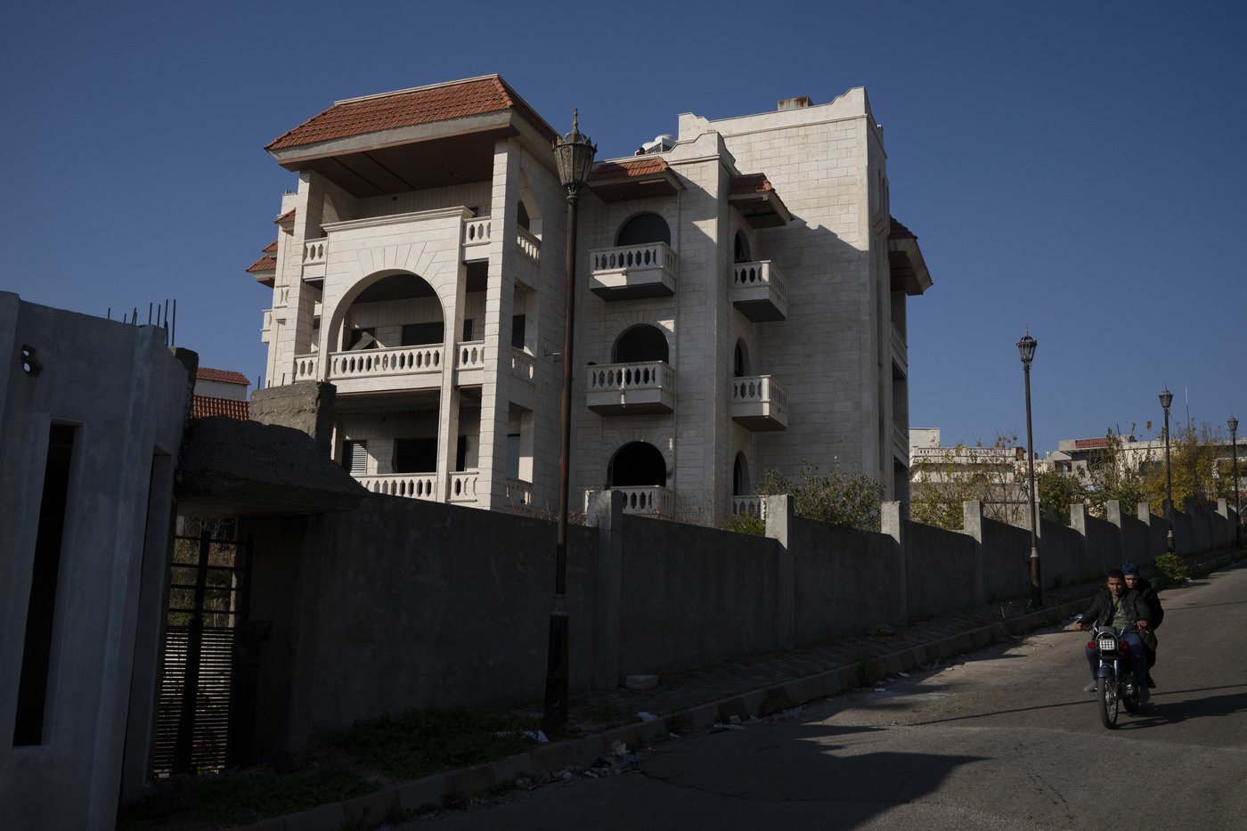 In Assad's hometown, few shared in his family's fortune. They hope they won't share in his downfall | iNFOnews.ca In Assad's hometown, few shared in his family's fortune. They hope they won't share in his downfall | iNFOnews.ca