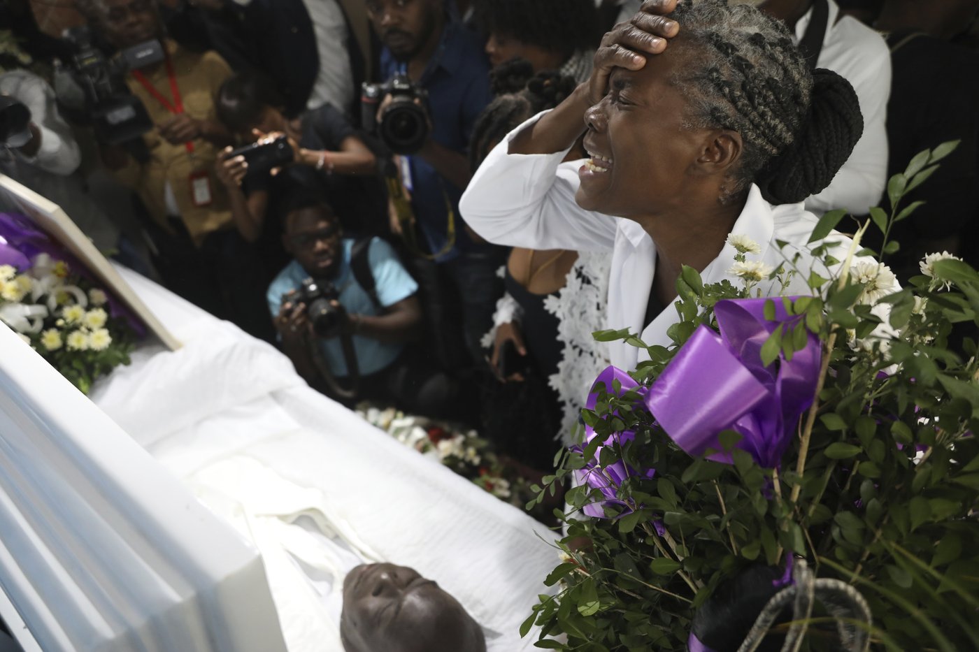 Mourners bury journalist killed in one of Haiti's worst attacks on reporters | iNFOnews.ca Mourners bury journalist killed in one of Haiti's worst attacks on reporters | iNFOnews.ca