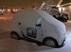 iNFOnews smart car covered in snow.