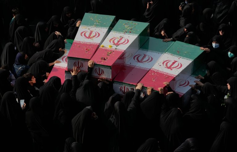 Photos show mourners in Tehran honoring the unknown soldiers killed in the 1980's Iran-Iraq war | iNFOnews.ca