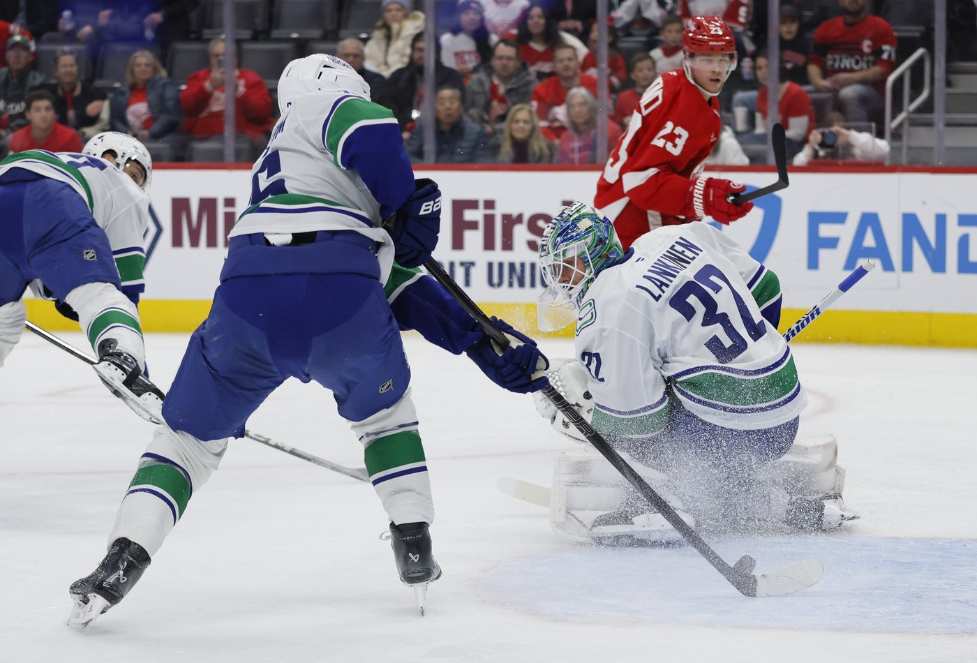 Jake DeBrusk scores hat trick, including OT game-winner, as Canucks top Red Wings 5-4 | iNFOnews.ca