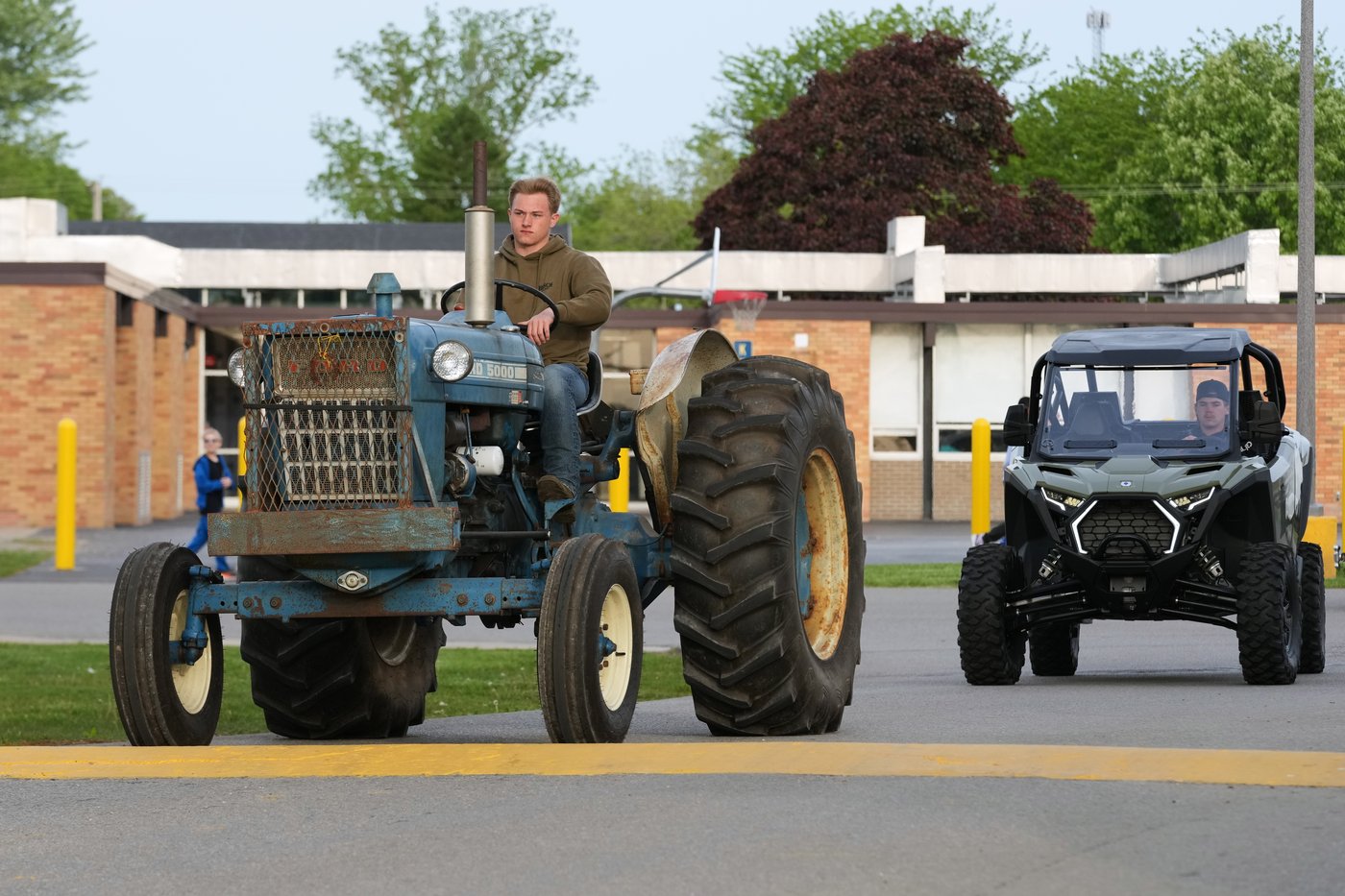 Tractors, ATVs and golf carts, oh my: Michigan seniors arrive at school in style on Tractor Day | iNFOnews.ca Tractors, ATVs and golf carts, oh my: Michigan seniors arrive at school in style on Tractor Day | iNFOnews.ca