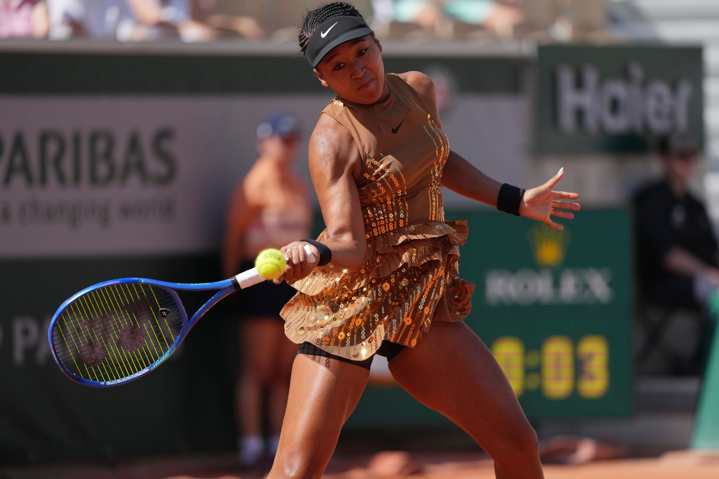 Naomi Osaka's latest French Open fashion ensemble includes an ivory train and gold jacket | iNFOnews.ca Naomi Osaka's latest French Open fashion ensemble includes an ivory train and gold jacket | iNFOnews.ca