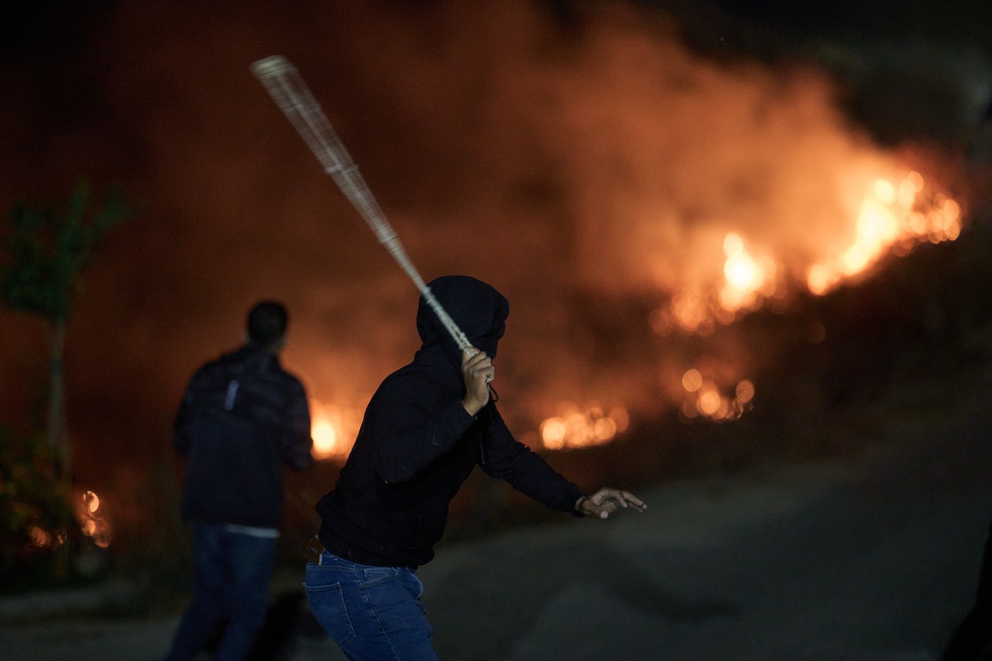 Photos show West Bank Palestinians keeping watch at night as settler violence grows | iNFOnews.ca