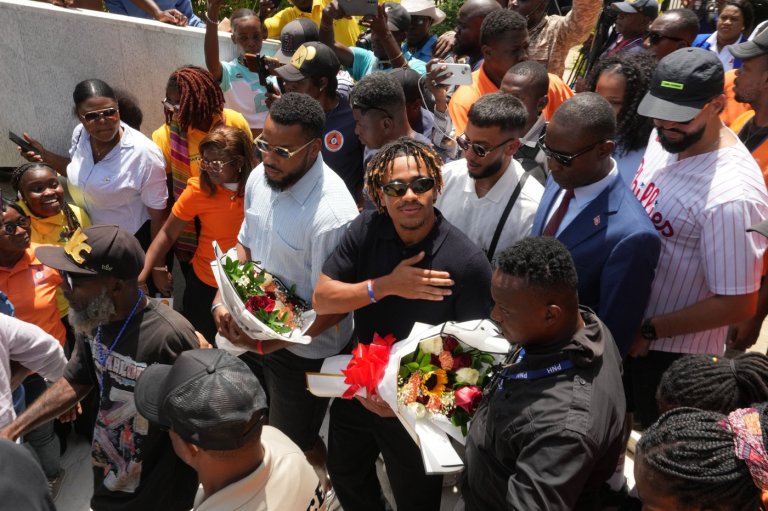 Members of Haiti's national soccer team tour their capital after playing in the World Cup | iNFOnews.ca