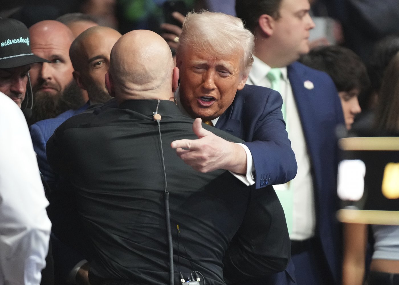 Trump sits cageside at Miami UFC event in his latest appearance at a sports event | iNFOnews.ca