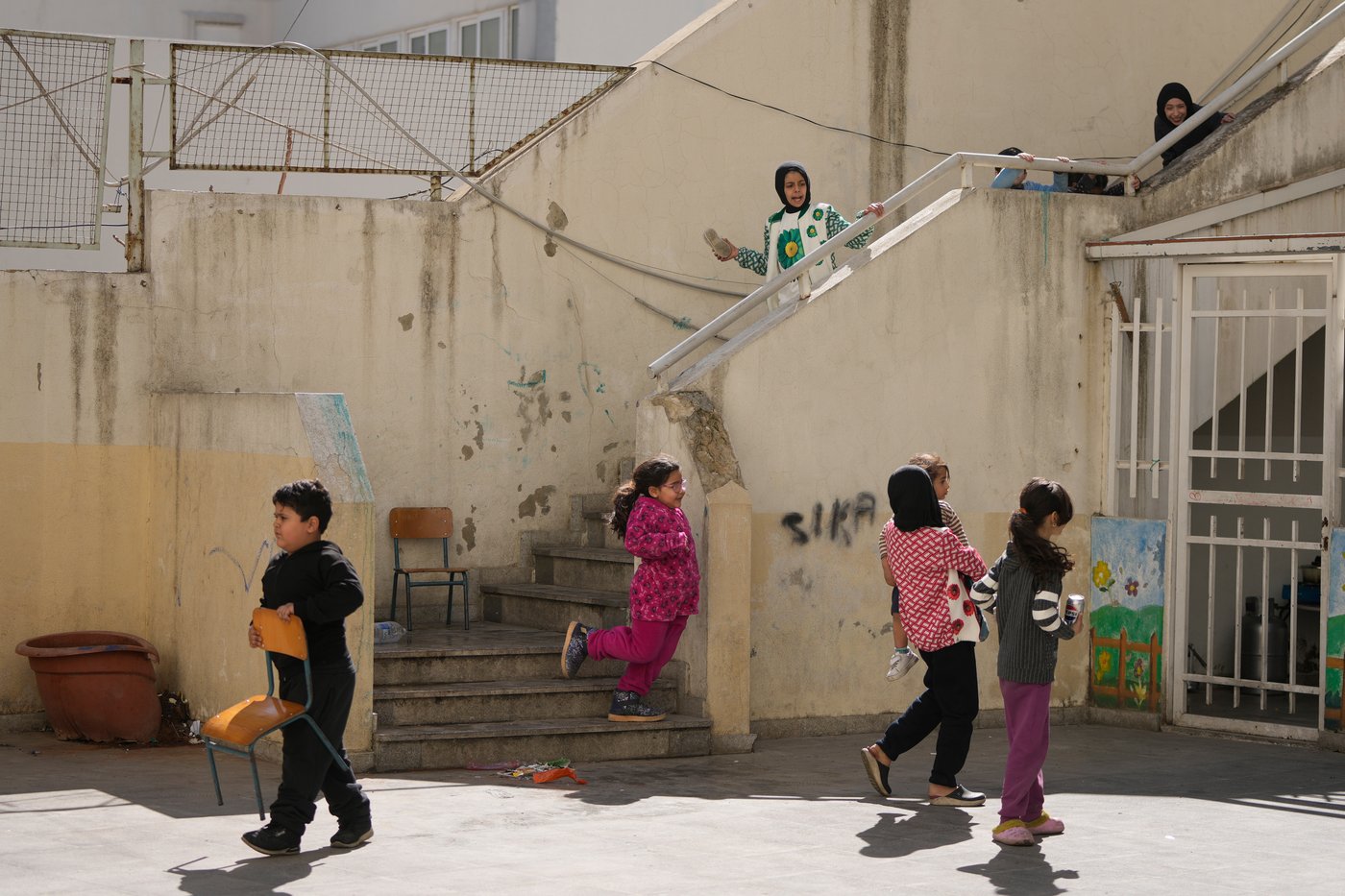 Photos of displaced civilians in Lebanon, where schools and stadiums turn into shelters during war | iNFOnews.ca