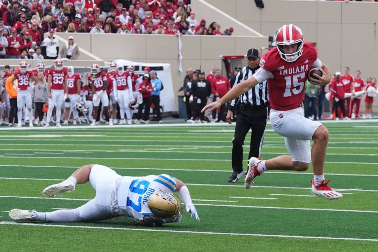 Aiden Fisher's early interception, Mendoza brothers' TD runs help No. 2 Indiana roll past UCLA 56-6 | iNFOnews.ca Aiden Fisher's early interception, Mendoza brothers' TD runs help No. 2 Indiana roll past UCLA 56-6 | iNFOnews.ca