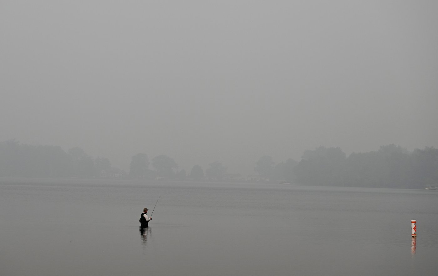 Heavy smoke from wildfires is darkening skies from the US Midwest to the East Coast, in photos | iNFOnews.ca