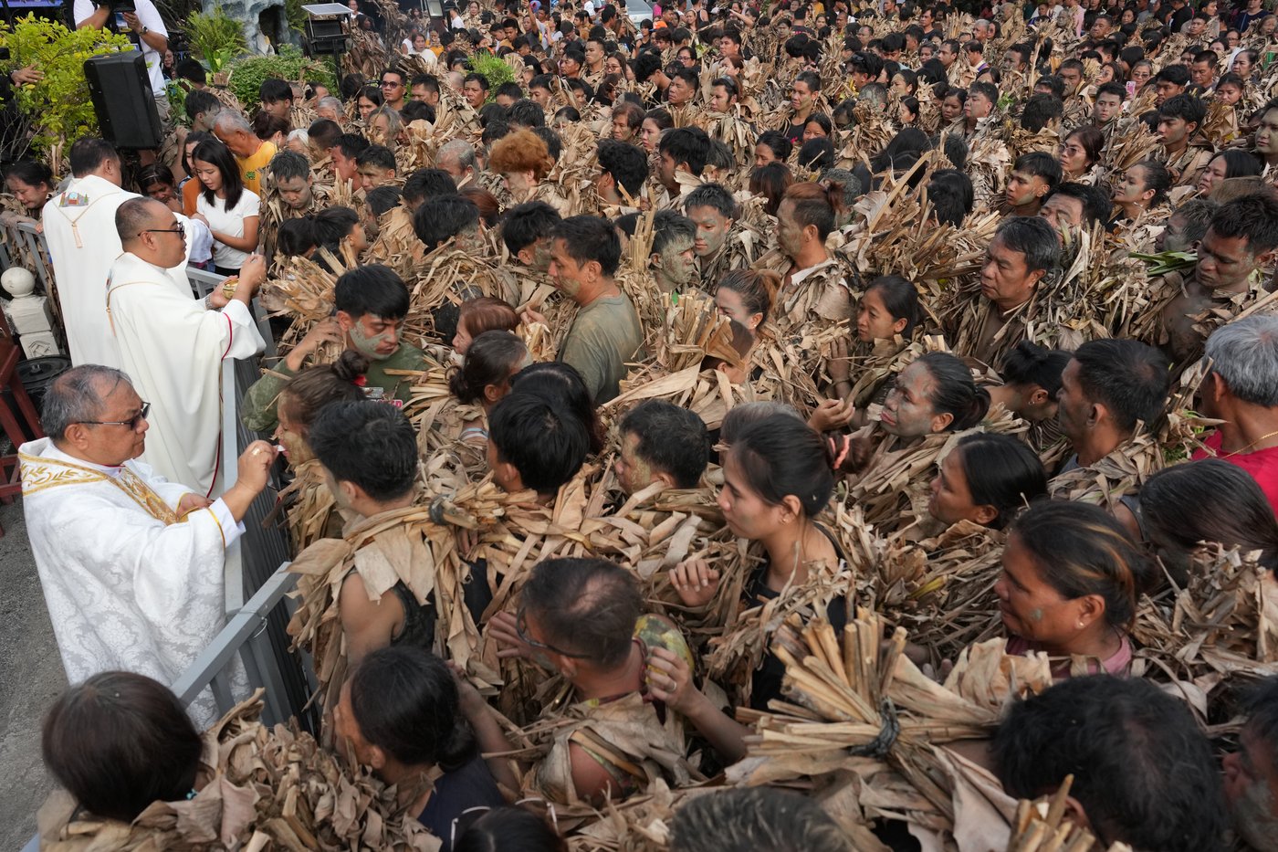 Photos show Philippine Catholics smearing mud on their bodies for festival honoring John the Baptist | iNFOnews.ca