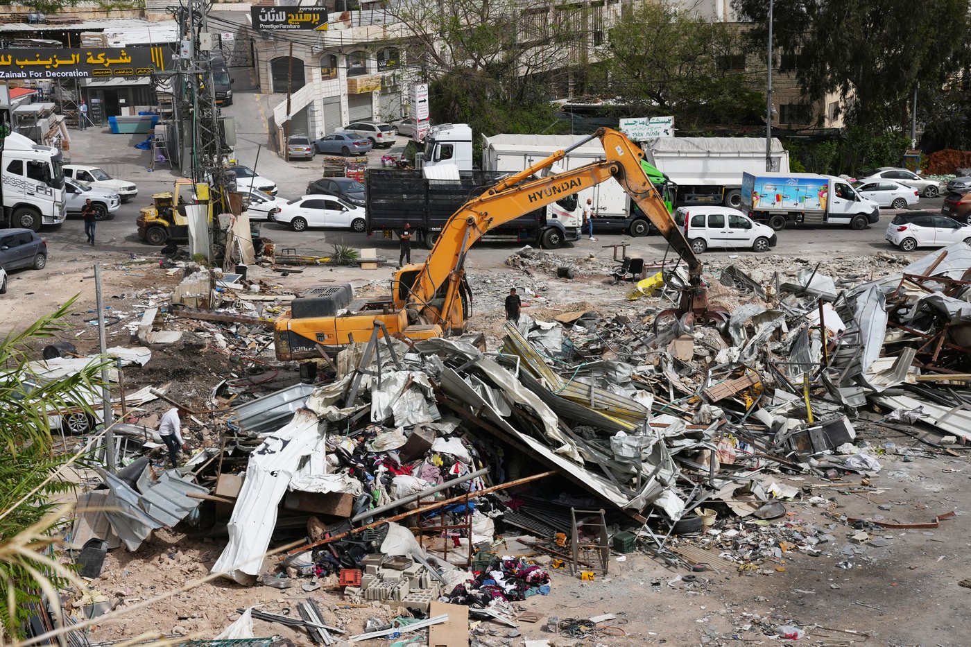 Israeli bulldozers raze about 50 Palestinian shops ahead of settlement-linked road project | iNhome Israeli bulldozers raze about 50 Palestinian shops ahead of settlement-linked road project | iNhome