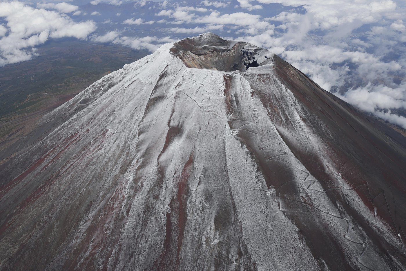 It's not official yet but Mount Fuji gets its trademark snowcap after the longest delay in 130 years | iNFOnews.ca