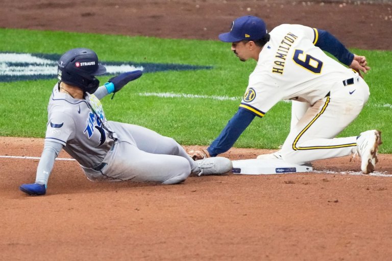 Balls glancing off gloves, runners thrown out trying to steal sink Rays in World Series opener | iNFOnews.ca