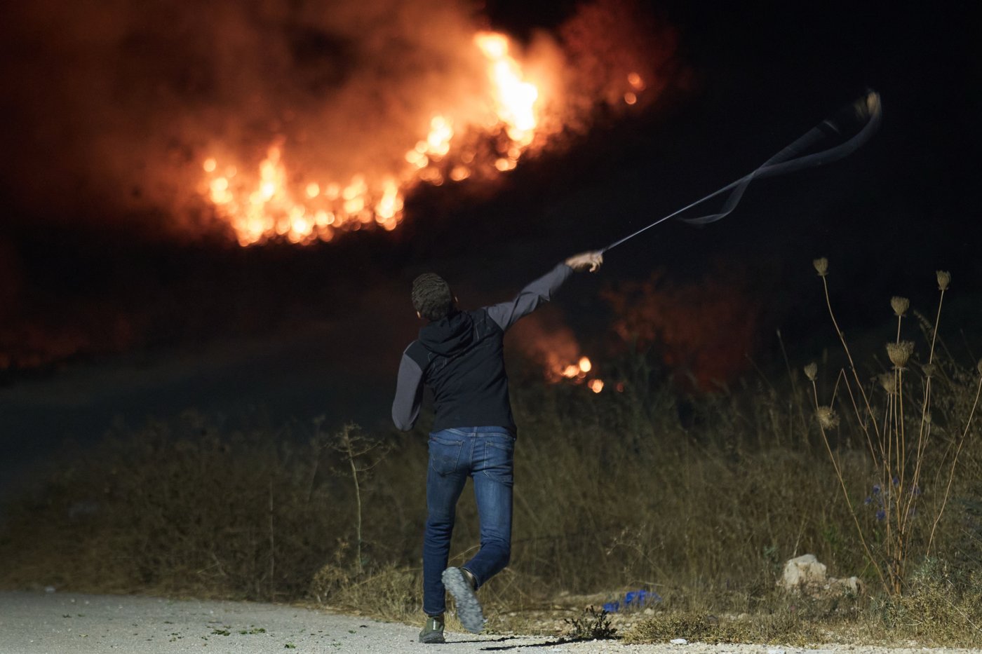 Photos show West Bank Palestinians keeping watch at night as settler violence grows | iNFOnews.ca
