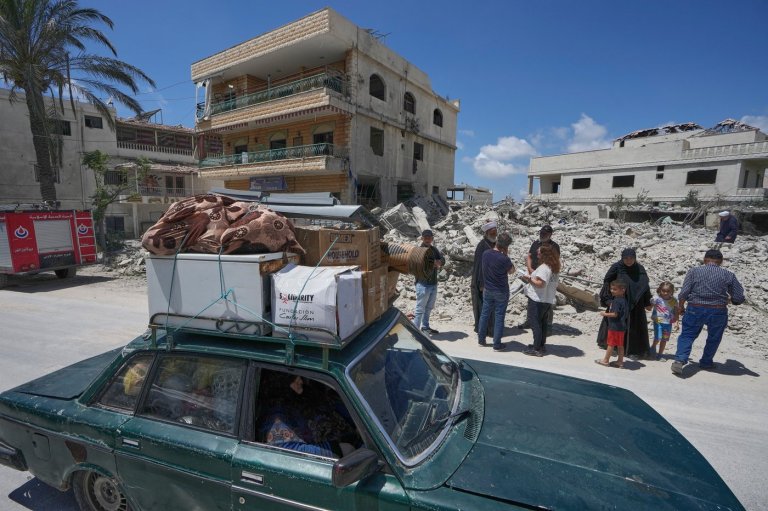 Lebanese return home to destruction after word of an initial US-Iran deal, in photos | iNFOnews.ca