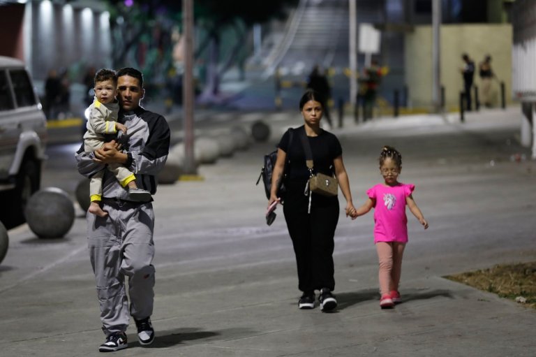 Photos show residents evacuating after explosions in Caracas, Venezuela | iNFOnews.ca