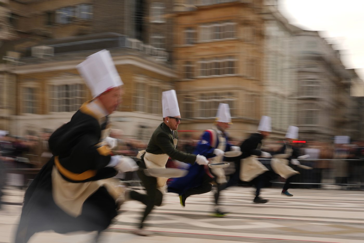 Londoners in costume sprinting through the streets with frying pans during the 2026 Pancake Day race on Shrove Tuesday
