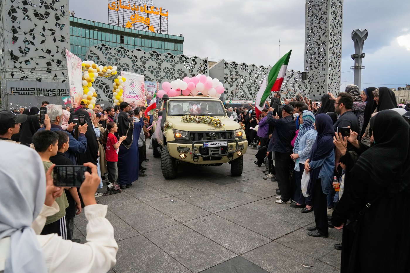 Photos of a mass wedding and a colorful missile at Tehran's 'Sacrifice for Iran' ceremony | iNFOnews.ca