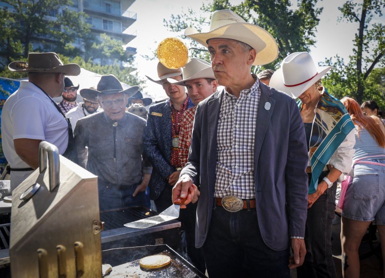 'I've been training all year': Carney masters the art of flipping Stampede flapjacks | iNFOnews.ca