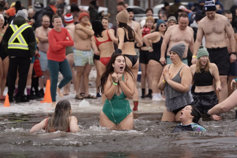 Many mark the new year with 'exhilarating' polar dip in icy water | iNFOnews.ca
