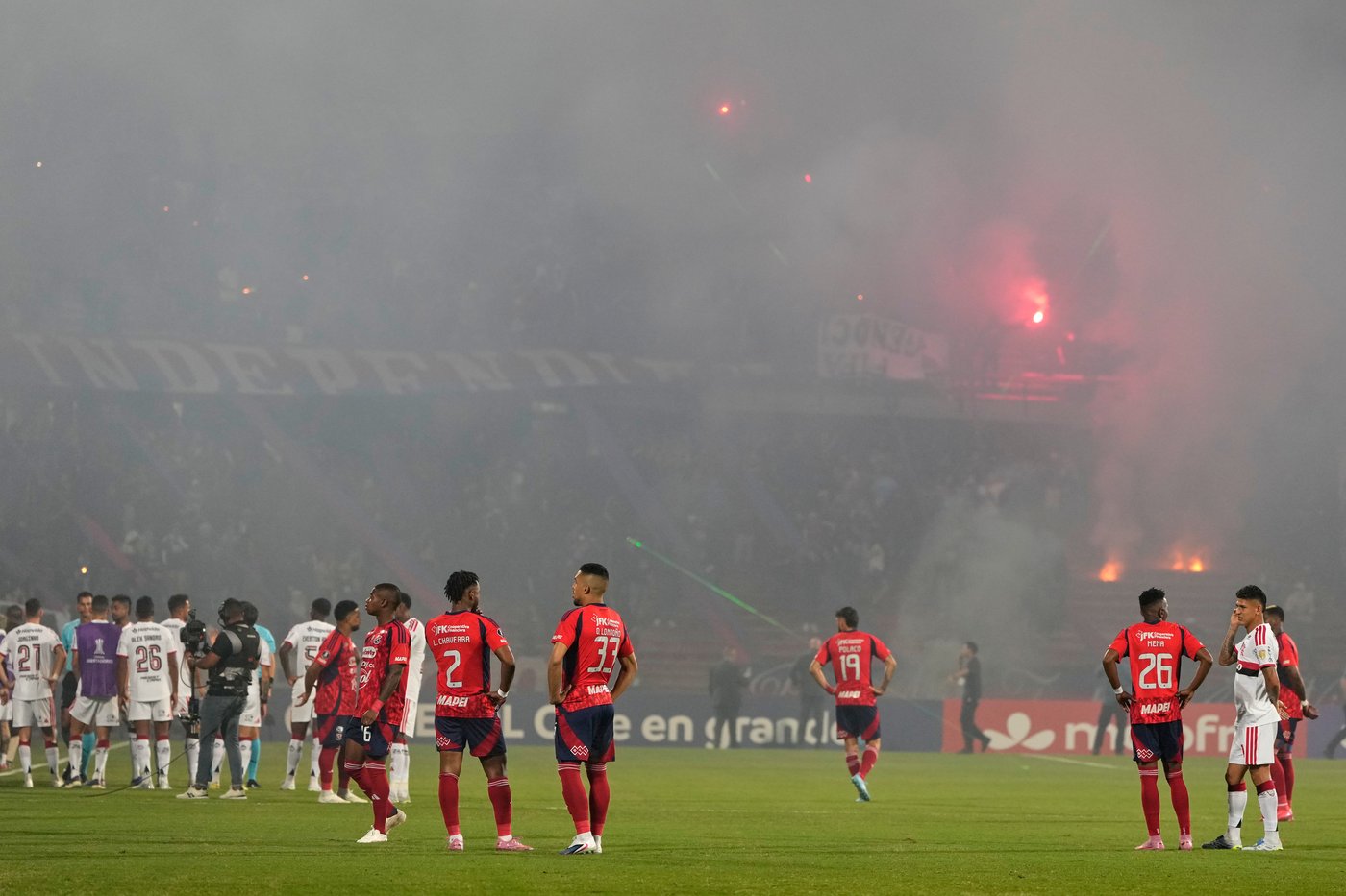 Copa Libertadores soccer match halted after just 3 minutes when fans protest with flares | iNFOnews.ca