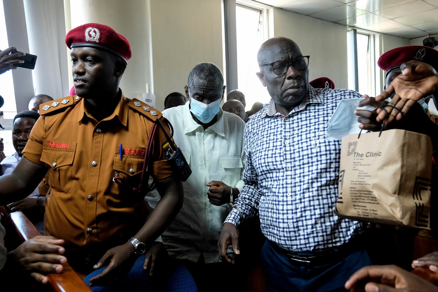 Ugandan opposition figure Besigye collapses in the dock during treason trial | iNFOnews.ca