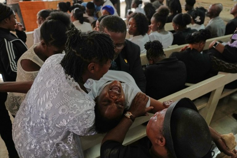 Mourners file into a church in Haiti where gangs killed dozens of people in latest rampage | iNFOnews.ca