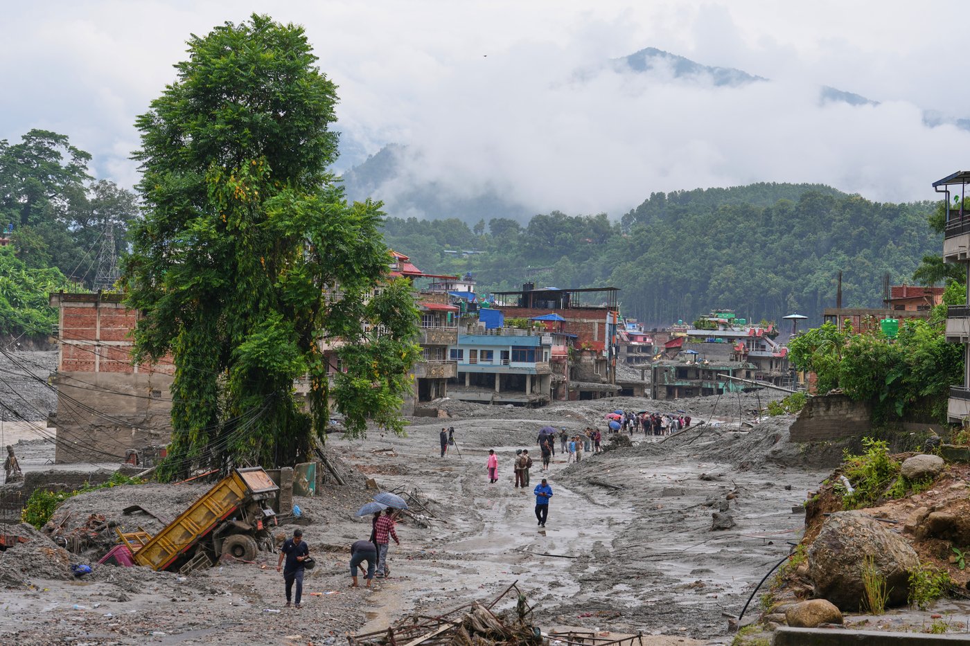 Nepal-China flood survivors reach safe areas as families await news of nearly 3,000 missing | iNFOnews.ca Nepal-China flood survivors reach safe areas as families await news of nearly 3,000 missing | iNFOnews.ca