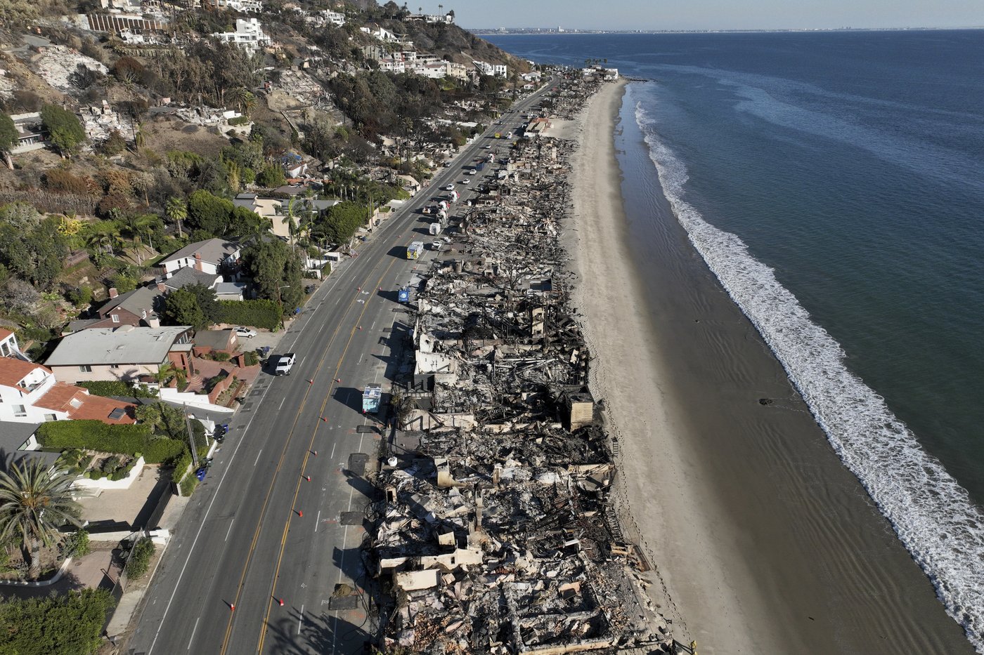 Windy, flame-fanning weather eases up as progress made on LA-area fires | iNFOnews.ca