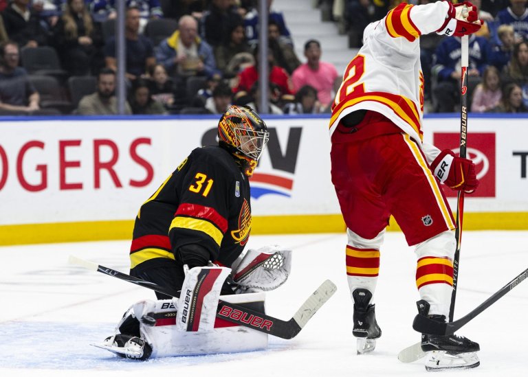 Canucks score four unanswered goals in third period to top Flames 4-1 | iNFOnews.ca