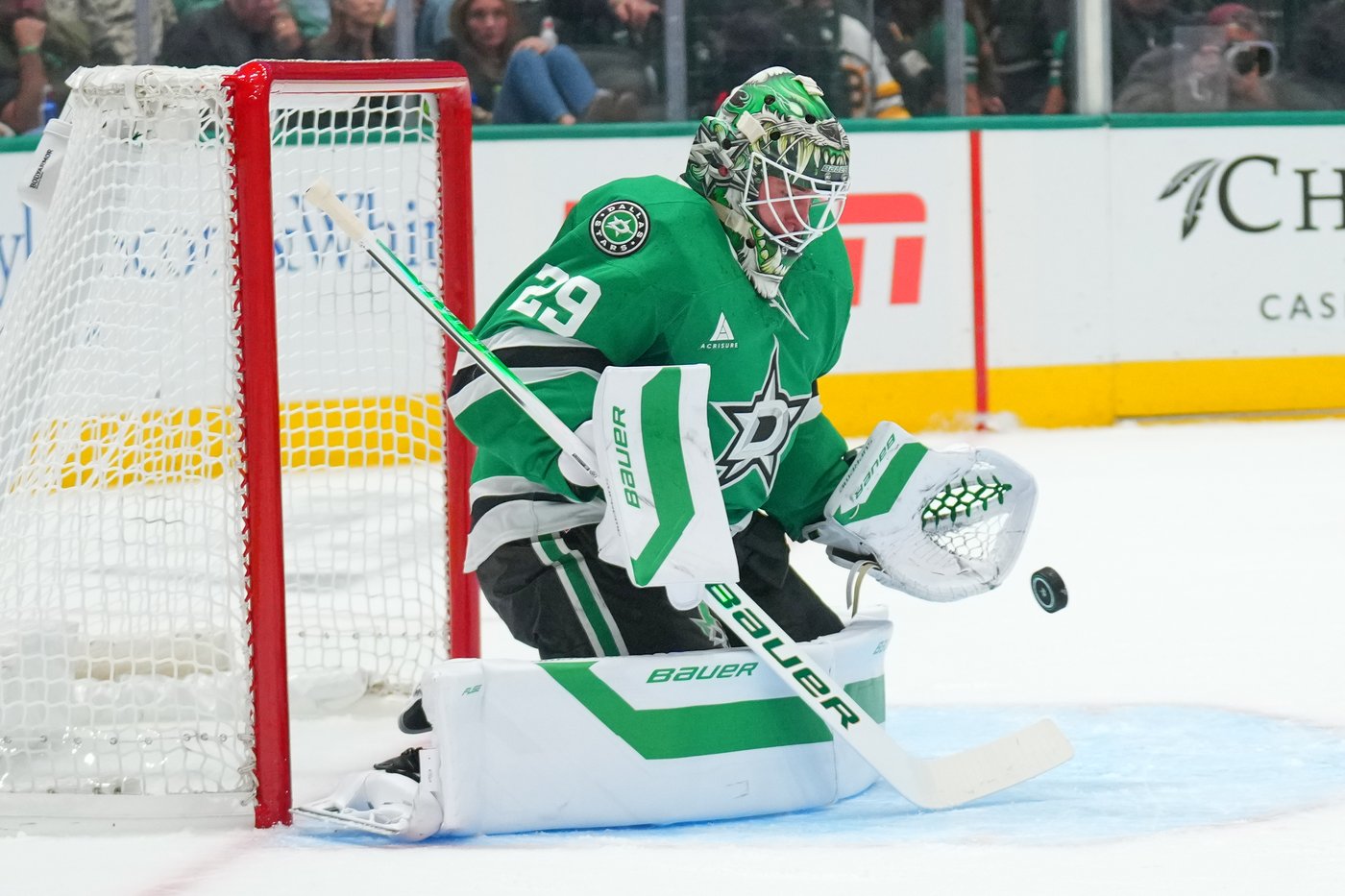 Dallas Stars goalie Jake Oettinger stops a Bruins shot October 20, 2026